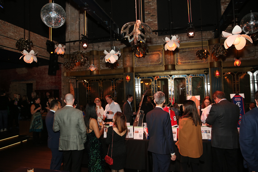 CROWD AROUND AUCTION TABLE