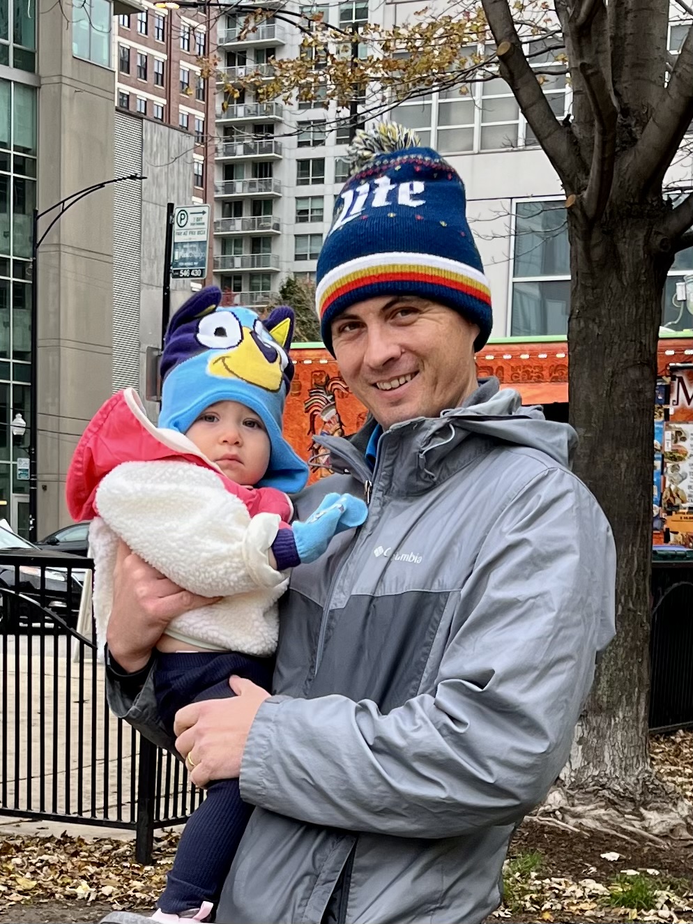 Dad with baby in blue hat